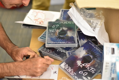 a developer signing a booklet